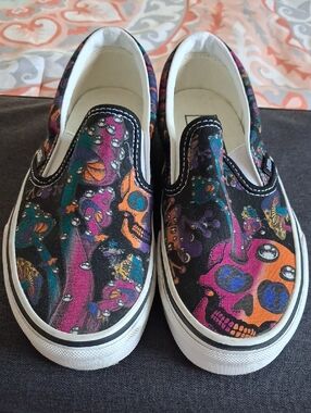 Unisex Vans Slip-On Canvas Shoes with Neon Skull Graphic - Black/Purple/Orange